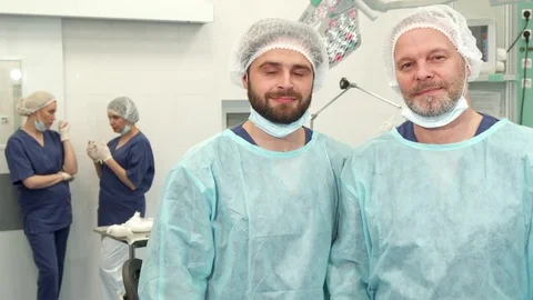 Two surgeons pose at the surgery room Stock Footage 73559073