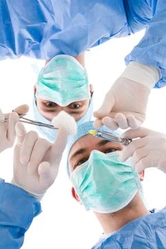 Two surgeons preparring for an injection Stock Photos