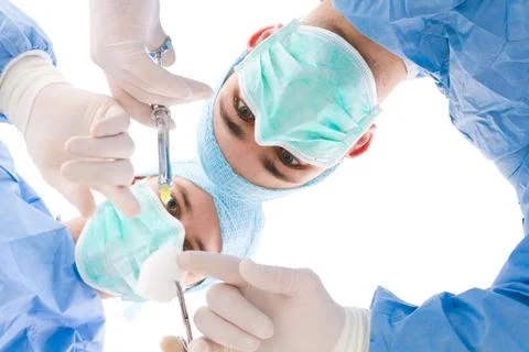 Two surgeons preparring for an injection Stock Photos