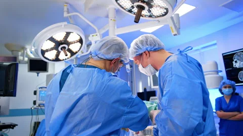 Two surgeons standing their backs to camera Stock Footage 292147293
