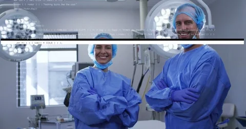 Two surgical staff standing in OR, reacting to coded-text glitches and Stock Footage 331214698