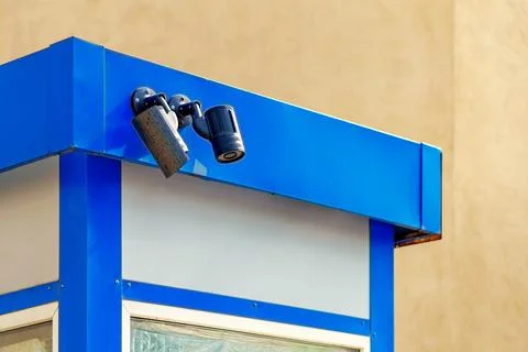 Two surveillance cameras looking down at the same location Stock Photos