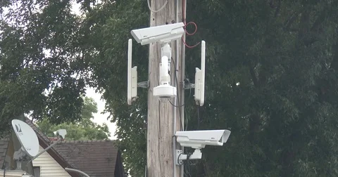 Two Surveillance Cameras on Pole Stock Footage 76922133