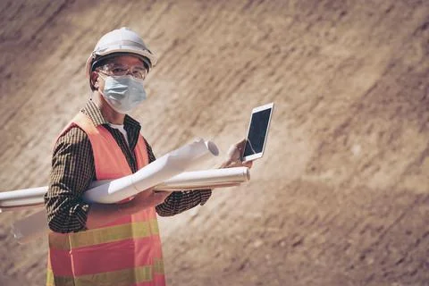 Two Surveyor builder Engineer technician  Business Team discuss plan at new c Stock Photos