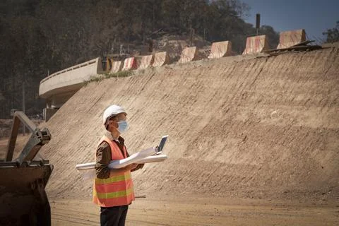 Two Surveyor builder Engineer technician  Business Team discuss plan at new c Stock Photos