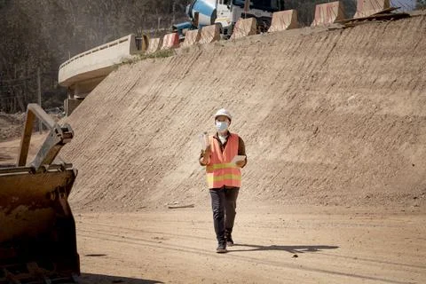 Two Surveyor builder Engineer technician  Business Team discuss plan at new c Stock Photos