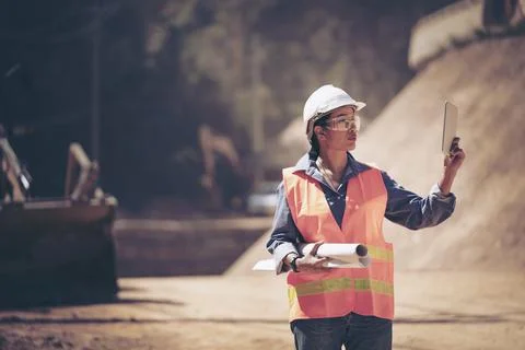 Two Surveyor builder Engineer technician  Business Team discuss plan at new c Stock Photos
