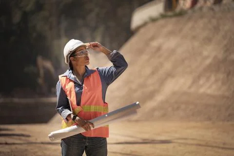 Two Surveyor builder Engineer technician  Business Team discuss plan at new c Stock Photos