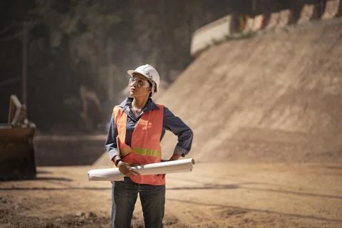 Two Surveyor builder Engineer technician  Business Team discuss plan at new c Stock Photos