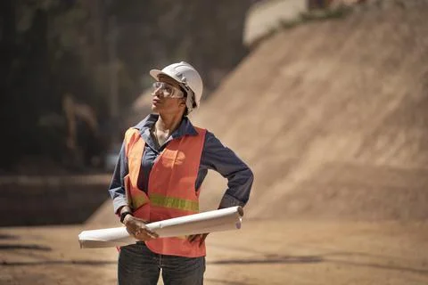 Two Surveyor builder Engineer technician  Business Team discuss plan at new c Stock Photos