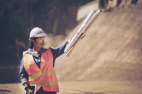 Two Surveyor builder Engineer technician  Business Team discuss plan at new c Stock Photos