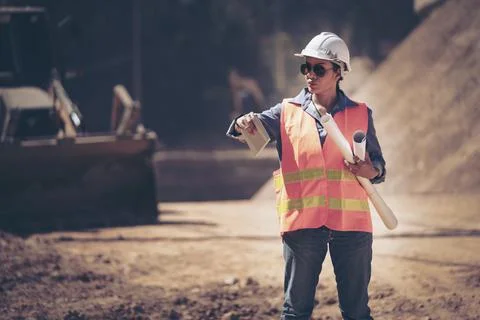 Two Surveyor builder Engineer technician  Business Team discuss plan at new c Stock Photos
