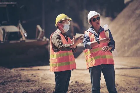 Two Surveyor builder Engineer technician  Business Team discuss plan at new c Foto stock