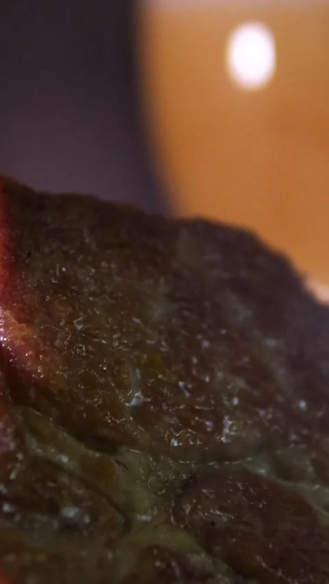 Two sweaty cold tulipa glasses of beer with grilled sliced cap rump steak on Vídeos de archivo 294695825