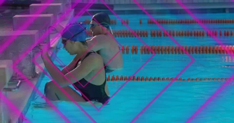 Two swimmers adjusting goggles on signal pushing off wall backstroking to start Stock Footage 320208302