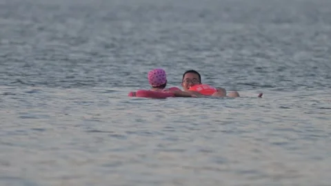 Two Swimmers with Pink Cap in Lake Stock-Footage 345040005