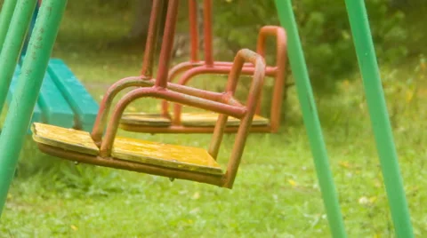 Two swing shakes on playground like pendulum Stock Footage 45178698