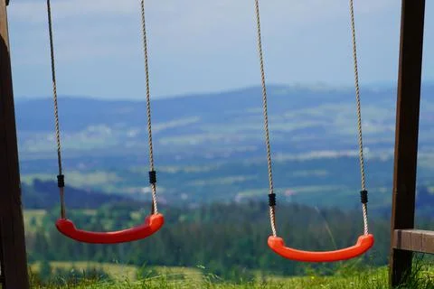 Two swings on strings Stock Photos