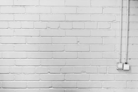 Two switches on the brick wall Stock Photos
