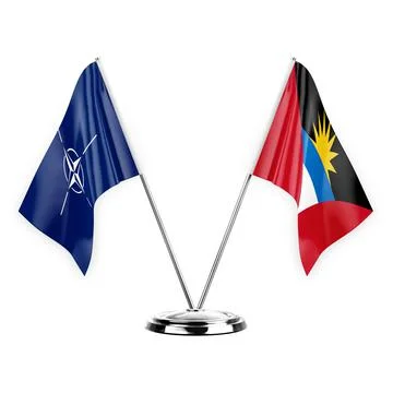 Two table flags isolated on white background 3d illustration, nato and antigu Stock Illustration