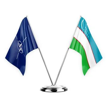 Two table flags isolated on white background 3d illustration, nato and uzbeki Stock Illustration