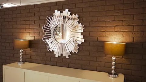 Two table lamps and a mirror on the background of a brick wall. Stylish interior Stock Footage 170578028
