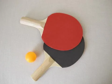 Two table tennis rackets and a tennis ball Stock Photos