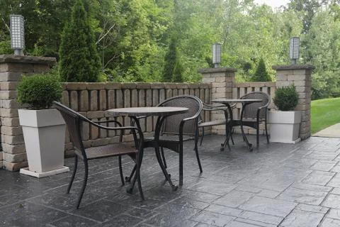 Two tables and chairs on hotel patio Stock Photos