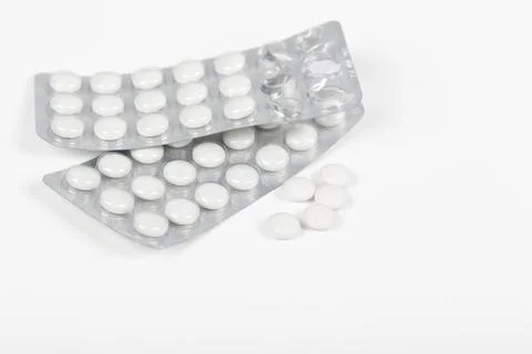 Two tablets of white pills Stock Photos