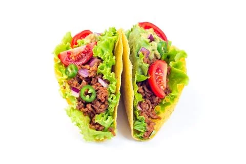 Two taco shells isolated on a white, with lettuce, ground beef meat Foto stock
