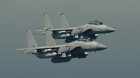 Two tactical twin jet engine fighter aircraft on a combat mission. Stock Footage 264841436