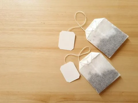 Two tea bags on the table Stock Photos