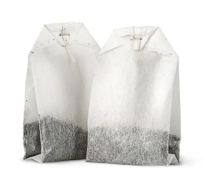 Two tea bags with thread vertically Stock Photos