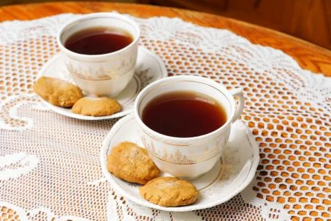Two tea cups with gold Stock Photos