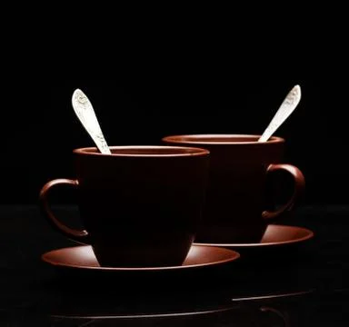 Two tea cups with teaspoons Stock Photos