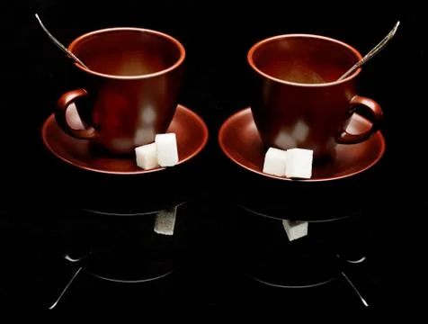 Two tea cups with teaspoons Stock Photos