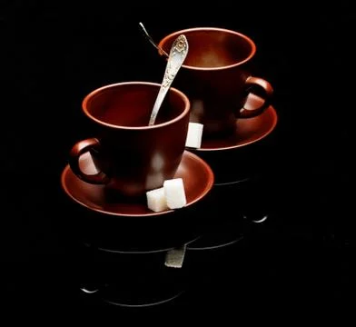 Two tea cups with teaspoons Stock Photos
