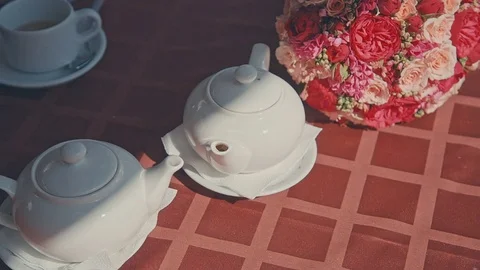 Two tea kettle are on the table Stock Footage 70532594