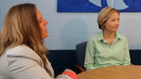 Two teachers talking with principal pan left to right Video stock 37211487