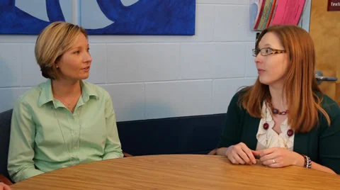 Two teachers talking with principal two shot Video stock 37211483