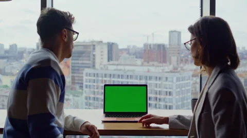 Two teammates looking greenscreen laptop working panoramic hall together closeup Stock Footage 335246096