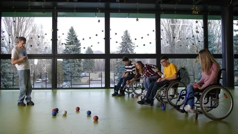 Two teams of disabled people playing boccia indoor Video stock 125727796