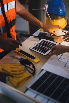 Two technicians inspect server racks in data center with tablet and fiber o.. Stock Photos