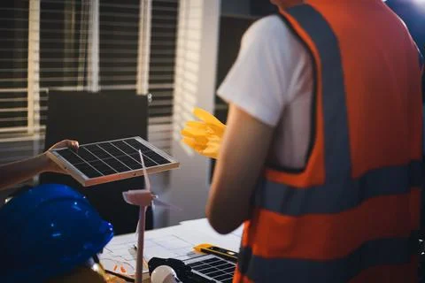Two technicians inspect server racks in data center with tablet and fiber o.. Stock Photos