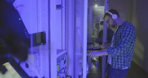 Two technicians work one of them dances Stock Footage 107383856