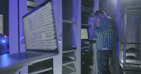 Two technicians work in server room. Stock Footage 107384551