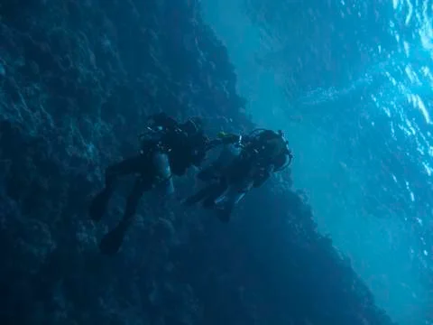 Two technodivers drift under the ocean surface Stock Photos