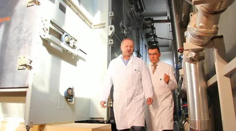 Two technologists working in the food industry Stock Footage 12441420