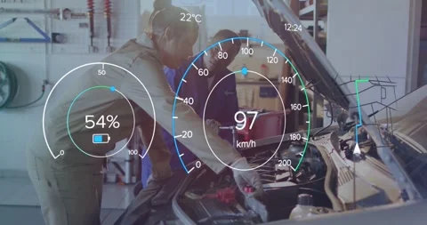 Two techs leaning over open hood with HUD overlay appearing attaching red clamp Stock Footage 334114151