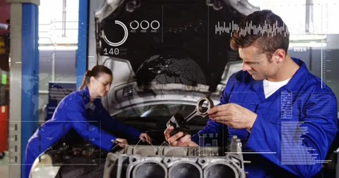 Two techs responding to telemetry gauges, inspecting piston and adjusting engine Stock Footage 331027006